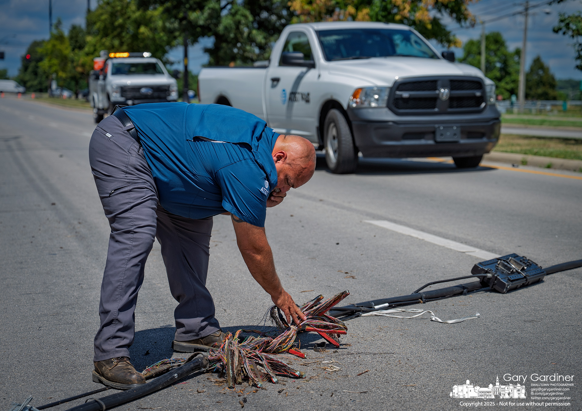 AT&T supervisor checks the break across the lanes.