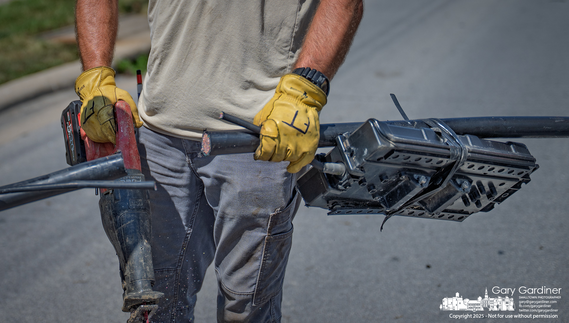 Reciprocating saw trims the heavy sheath.