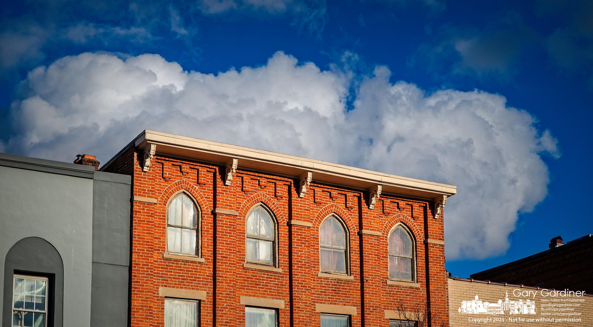 uptown-buildings-clouds-scenic-2025-01-31-004498.nef
